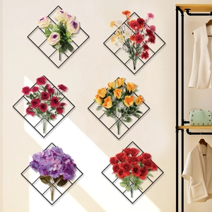 Floral wall art set with faux roses and carnations on black metal grids for home decor