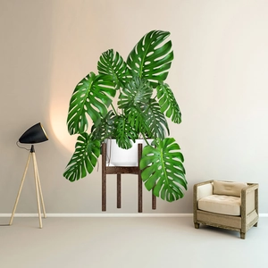 Detail of Monstera wall sticker showing green potted plant with minimalist wood stand