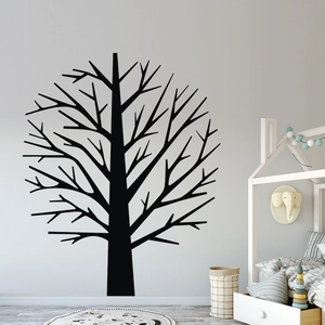 Detail of black tree silhouette wall decal in a modern minimalist nursery room decor