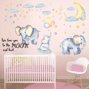 Détail des stickers muraux éléphant et lune avec texte We love you to the moon and back