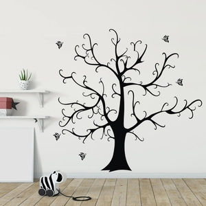 Artistic black tree wall decal with flying butterflies in a modern nursery interior