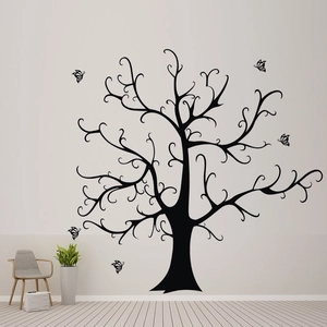 Detail of black tree wall decal and butterfly stickers in a modern living room