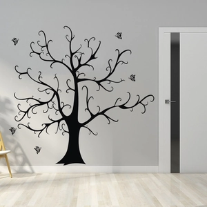 Detail of black tree silhouette wall sticker with butterflies in a modern living room