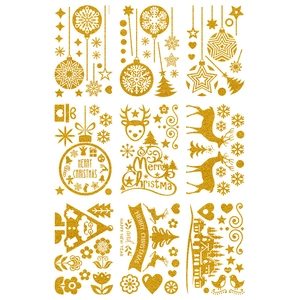 Detail of glitter gold Christmas stickers featuring reindeer, snowflakes and festive greetings