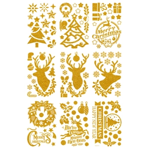 Detail of glitter gold Christmas stickers with reindeer and snowflake patterns for window decor