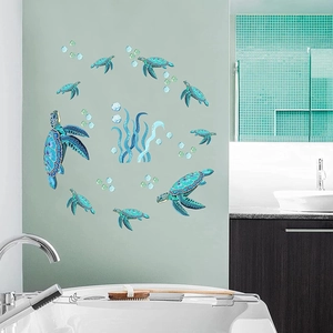 Detailed sea turtle wall decals with bubbles and seagrass displayed on a bathroom wall