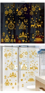 Macro detail of gold glitter Santa Claus and reindeer window stickers for Christmas decor