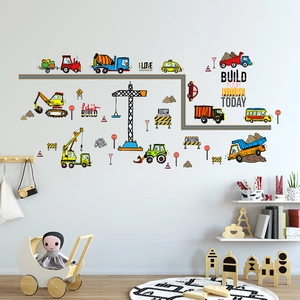Detail of construction truck wall decals featuring excavators and cranes in a kid bedroom