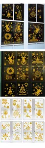 Detail view of golden glitter Christmas window stickers with reindeer and snowflakes