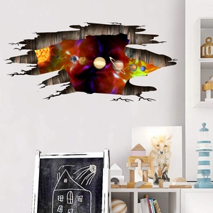 Detail of 3D solar system wall sticker showing planets through a cracked wall effect