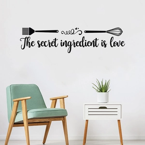 Minimalist black PVC kitchen wall sticker featuring the secret ingredient is love quote