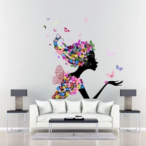 Detailed wall decal featuring a flower fairy silhouette with butterflies in a modern living room