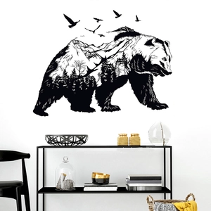 Detail of bear silhouette wall decal featuring mountain forest and birds in black