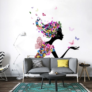 Modern wall sticker featuring a floral woman silhouette on a living room wall