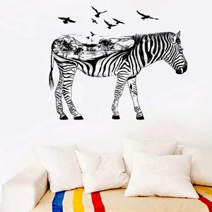 Artistic zebra silhouette wall sticker featuring mountain scenery on a white living room wall