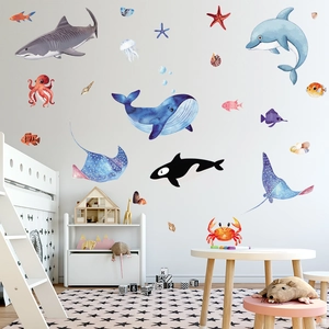 Detailed view of watercolor ocean animal wall decals arranged in a cozy kids bedroom