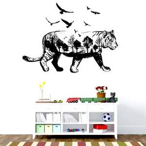 Detail of tiger silhouette wall sticker with forest landscape and flying birds