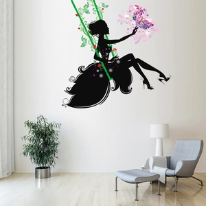 Girl on a swing with colorful butterflies wall decal in a minimalist living room setting