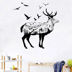 Artistic elk silhouette wall decal with mountain and forest scenes in a Nordic living room