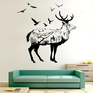 Detail of artistic elk wall decal featuring mountain landscape and birds for home decoration