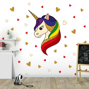 Nursery wall sticker detail featuring a cartoon unicorn head with sparkly heart decals
