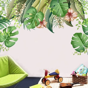 Detail of tropical monstera leaf wall stickers with hibiscus flowers in kids room