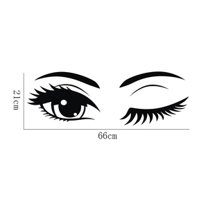 Détail du sticker mural cils montrant les dimensions 66cm par 21cm en vinyle noir