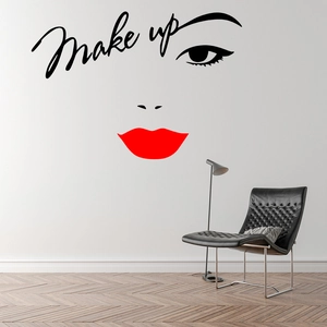 Detail view of vinyl makeup wall sticker with red lips and artistic eyeliner on white wall