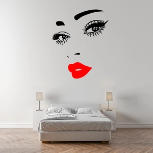 Minimalist vinyl wall sticker featuring red lips and long eyelashes on a white bedroom wall