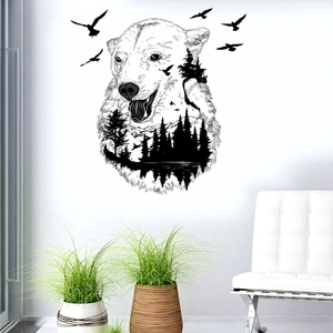 Detail of polar bear silhouette wall decal with forest and mountain landscape design