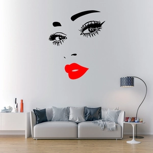 Detail of red lips and eyelashes wall sticker in a modern minimalist living room