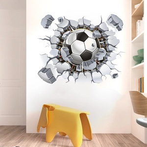 Detail of 3D football wall decal showing broken wall effect in a modern kids room setting