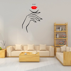 Minimalist vinyl wall decal featuring female face silhouette and red lips in a living room