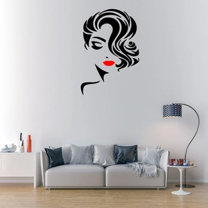 Detailed view of creative vinyl wall decal featuring abstract woman face and red lips for salon