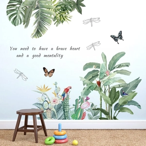 Tropical leaf wall decals with parrots and brave heart quote in a cozy home setting