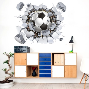 Detail of 3D football wall decal showing broken wall effect and black and white soccer ball