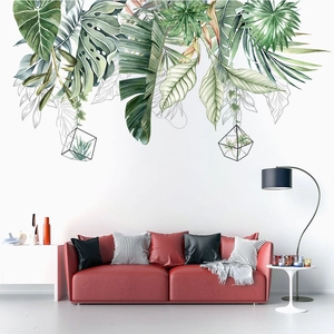 Nordic tropical watercolor green leaves wall stickers with black geometric frames over sofa