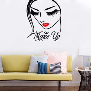 Close-up of minimalist black face line art wall decal with red lips and Make-Up text