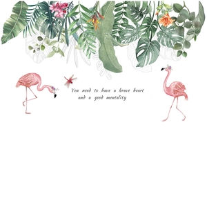 Nordic wall decal featuring tropical green leaves and pink flamingos with artistic text