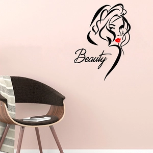 Minimalist female face vinyl wall decal with red lips and Beauty text in a modern room