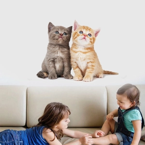 3D self-adhesive wall sticker featuring cute kittens in a warm family living room setting