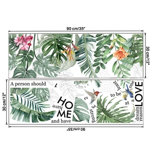 Detail of tropical monstera leaves and birds wall decals with HOME quotes in 30x90cm size