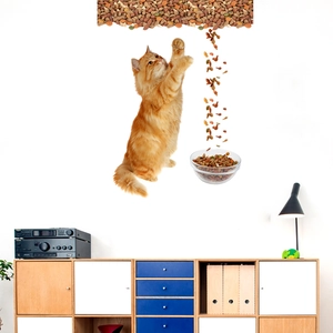 3D cat wall decal showing an orange cat climbing towards a cat food bowl on a white wall