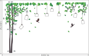 Nature wall sticker layout with large tree, green leaves, bird silhouettes and photo frames
