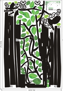 Detail view of the PVC wall sticker layout showing tree branches and bird silhouettes