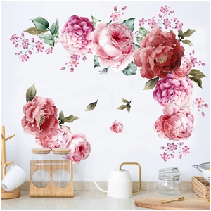 Vista detallada de adhesivos de pared rosas de acuarela en una superficie blanca de cocina