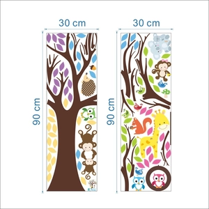 Detail view of cartoon forest animal wall stickers featuring a tree, giraffe, and monkey