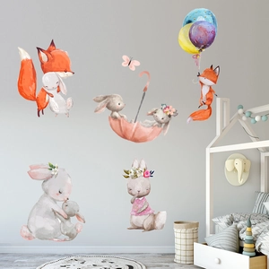 Nursery wall stickers featuring watercolor foxes and rabbits with balloons and umbrellas