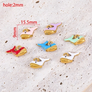 Detail showing 15.5x9mm colorful enamel whale pendants with gold plating and 2mm hole size