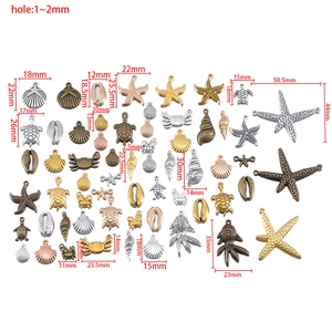 Assorted ocean themed vintage alloy charms including starfish and turtles with sizing